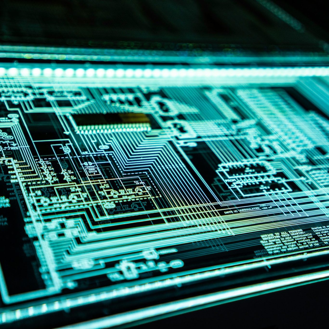 Glowing circuit board representing connected systems and intelligent automation
